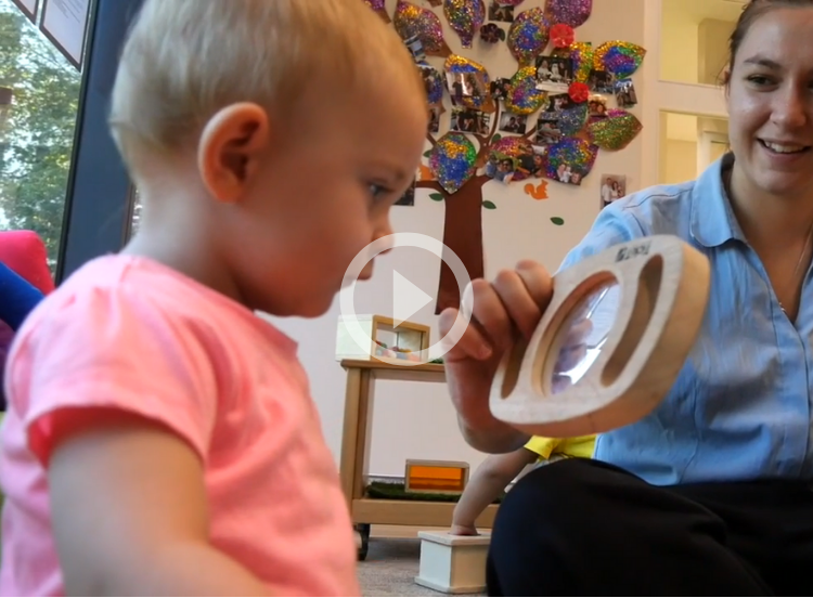 Baby playing with mirror Kids Club