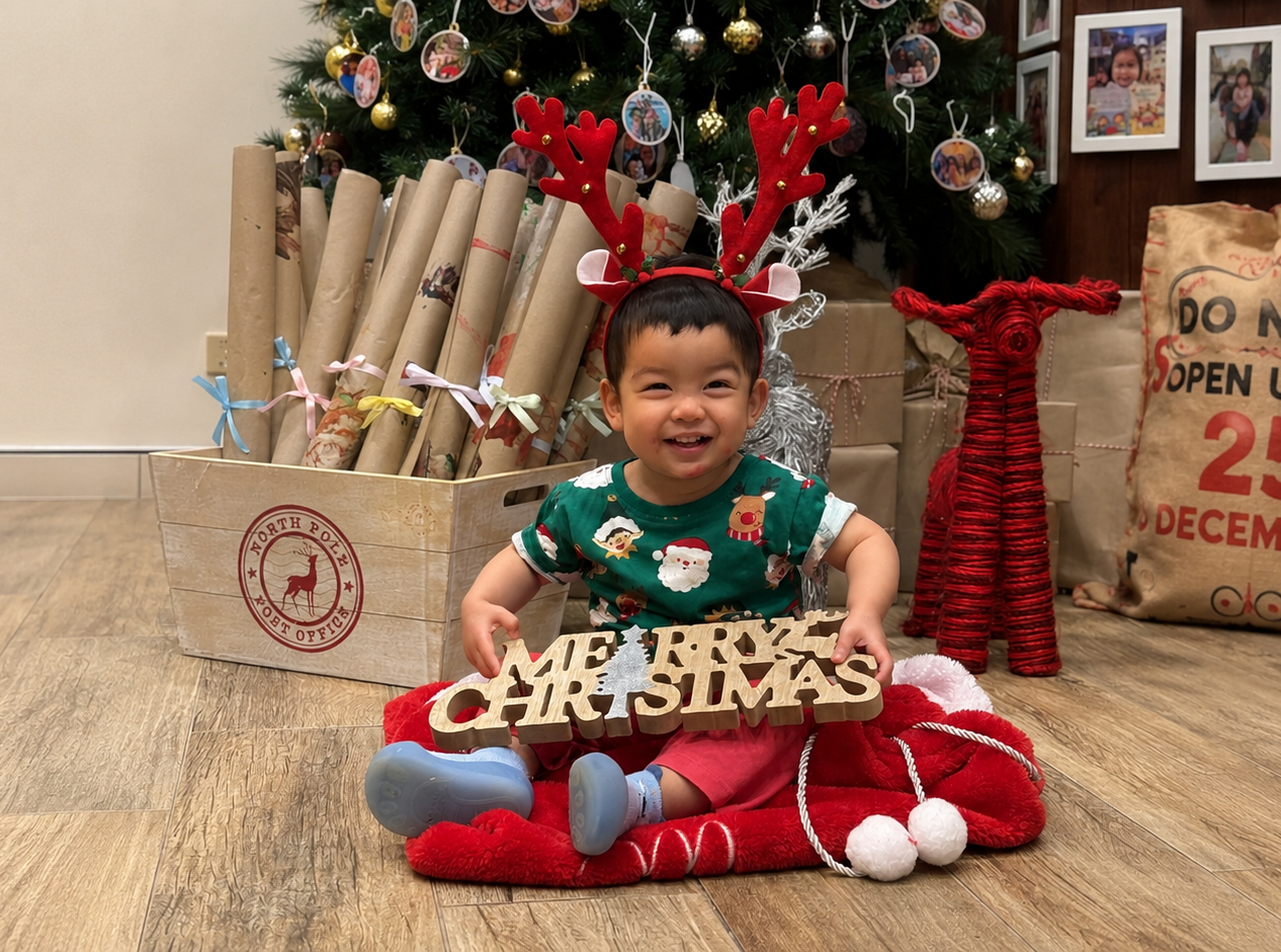 Child celebrating Christmas at Kids Club Childcare with festive decorations and holiday activities for the Kids Club Christmas Cook Book 2024.