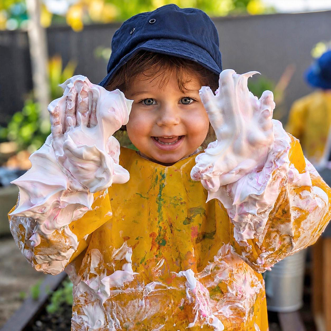 Column image Child involved in sensory play at Kids Club Tweed Heads