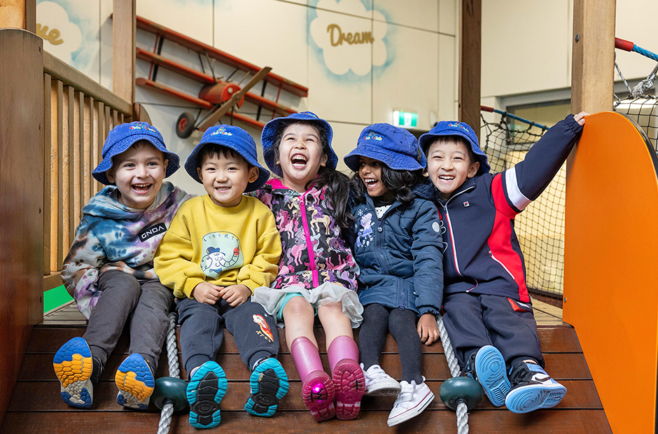 Carousel image Children enjoying group play and building positive friendships in a safe and supportive learning environment at Kids Club Childcare Centre.