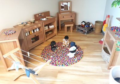 Column image Children engaged in imaginative play inside a Kids Club childcare centre dramatic play learning environment