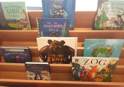Column image Children’s reading and literacy book display inside a Kids Club childcare centre library area